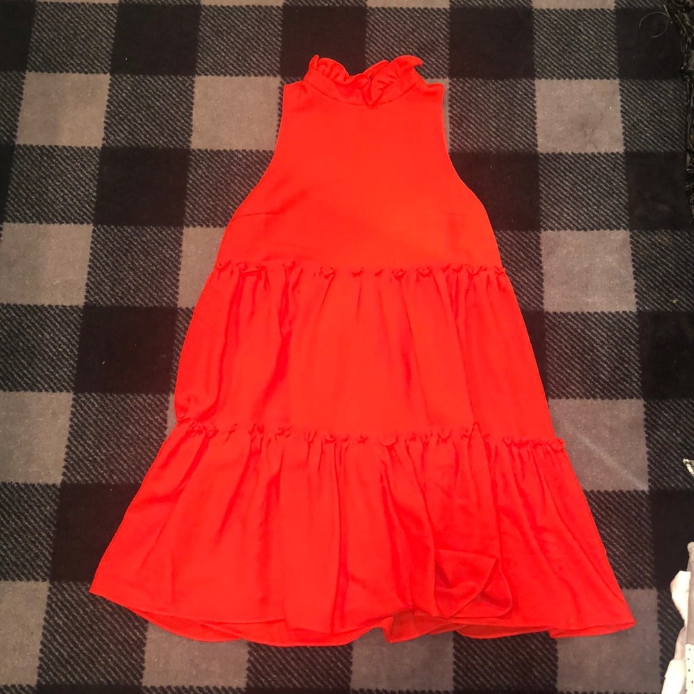 Red dress with ruffle detail and high neck ruffle